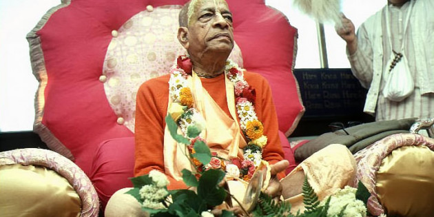 Srila Prabhupada Sitting on Vyassasana with Devotee fanning him with Chamara
